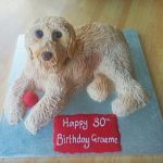 Dog sculpted birthday cake